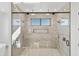 Large walk-in shower with marble tile and double shower heads at 31 W Canyon St, Apache Junction, AZ 85120