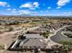 Aerial view of house with pool and mountain views at 319 S 227Th Ct, Buckeye, AZ 85326