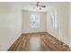 Well-lit bedroom with hardwood floors and plantation shutters at 319 S 227Th Ct, Buckeye, AZ 85326