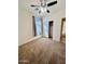 Bedroom with neutral carpet, ceiling fan, window and closet with sliding doors at 319 S 227Th Ct, Buckeye, AZ 85326