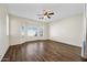 Bright bedroom featuring bay window and ceiling fan at 319 S 227Th Ct, Buckeye, AZ 85326