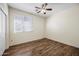 Bedroom with wood floors and ceiling fan at 319 S 227Th Ct, Buckeye, AZ 85326