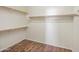Spacious closet with wood shelving and flooring at 319 S 227Th Ct, Buckeye, AZ 85326