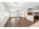 Large dining room with hardwood floors and chandelier at 319 S 227Th Ct, Buckeye, AZ 85326