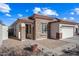 One-story home with stone accents and a two-car garage at 319 S 227Th Ct, Buckeye, AZ 85326