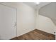 Hallway with wood flooring and access to other rooms at 319 S 227Th Ct, Buckeye, AZ 85326
