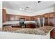 Modern kitchen with granite countertops and stainless steel appliances at 319 S 227Th Ct, Buckeye, AZ 85326
