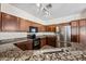 Modern kitchen with stainless steel appliances and granite countertops at 319 S 227Th Ct, Buckeye, AZ 85326
