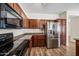 Kitchen boasts granite counters and stainless steel appliances at 319 S 227Th Ct, Buckeye, AZ 85326