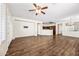 Bright living area featuring hardwood floors and access to backyard at 319 S 227Th Ct, Buckeye, AZ 85326