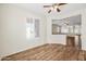 Spacious living area with hardwood floors and plantation shutters at 319 S 227Th Ct, Buckeye, AZ 85326