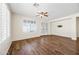 Living room with hardwood floors and large windows at 319 S 227Th Ct, Buckeye, AZ 85326