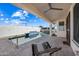 Relaxing pool area with patio and seating at 319 S 227Th Ct, Buckeye, AZ 85326