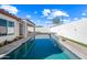 Long rectangular pool with a water feature and patio at 319 S 227Th Ct, Buckeye, AZ 85326