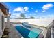 Relaxing rectangular pool with a stone water feature at 319 S 227Th Ct, Buckeye, AZ 85326