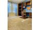 Bedroom featuring natural light, built in shelves, and neutral carpet at 3301 S Goldfield Rd # 3038, Apache Junction, AZ 85119