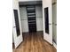 Walk-in closet with wood floors and custom shelving for optimal organization at 3301 S Goldfield Rd # 3038, Apache Junction, AZ 85119