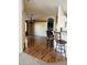 Open dining room area with wood floors, chandelier, and archway to kitchen at 3301 S Goldfield Rd # 3038, Apache Junction, AZ 85119