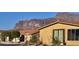 Neighborhood home featuring a red tile roof with views of the desert mountain range at 3301 S Goldfield Rd # 3038, Apache Junction, AZ 85119