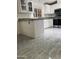 Updated kitchen featuring white cabinets, gray countertops, and stainless steel appliances at 3301 S Goldfield Rd # 3038, Apache Junction, AZ 85119
