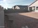 Backyard view of house and neighbor at 36061 W Santa Clara Ave, Maricopa, AZ 85138