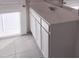 Bathroom featuring a vanity with white cabinets at 36061 W Santa Clara Ave, Maricopa, AZ 85138