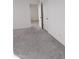 Bright bedroom with grey carpet and double doors at 36061 W Santa Clara Ave, Maricopa, AZ 85138