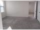 Spacious bedroom with grey carpet and window at 36061 W Santa Clara Ave, Maricopa, AZ 85138