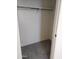 Closeup of a closet with hanging rod and grey carpet at 36061 W Santa Clara Ave, Maricopa, AZ 85138