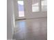 Bright dining area with tile floors and backyard access at 36061 W Santa Clara Ave, Maricopa, AZ 85138