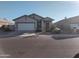 Newly built home with a two-car garage, and drought-tolerant landscaping at 36061 W Santa Clara Ave, Maricopa, AZ 85138