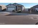 Single-story house with a two-car garage and desert landscaping at 36061 W Santa Clara Ave, Maricopa, AZ 85138