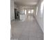 Open concept kitchen with an island, stainless steel appliances, and tile flooring at 36061 W Santa Clara Ave, Maricopa, AZ 85138