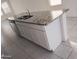 Modern kitchen island with granite countertops and stainless steel sink at 36061 W Santa Clara Ave, Maricopa, AZ 85138
