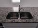 Stainless steel double sink with granite countertop at 36061 W Santa Clara Ave, Maricopa, AZ 85138