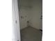 Convenient laundry room with tile floors and shelving at 36061 W Santa Clara Ave, Maricopa, AZ 85138