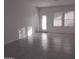 Open living area with tile flooring and access to the backyard at 36061 W Santa Clara Ave, Maricopa, AZ 85138