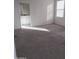 Main bedroom with carpet and ensuite bathroom access at 36061 W Santa Clara Ave, Maricopa, AZ 85138