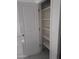 Walk-in pantry with ample shelving for storage at 36061 W Santa Clara Ave, Maricopa, AZ 85138
