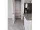 Well-lit pantry with multiple shelves for kitchen storage at 36061 W Santa Clara Ave, Maricopa, AZ 85138
