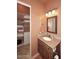 Bathroom with vanity, large mirror, and linen closet at 37103 N Boulder View Dr, Scottsdale, AZ 85262