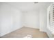 Empty spare bedroom with tile flooring and window at 39626 N Lost Legend Dr, Phoenix, AZ 85086