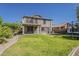 View of the house from the backyard with a lush lawn and trampoline at 4275 E Amarillo Dr, San Tan Valley, AZ 85140