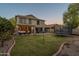 Large backyard with patio, string lights, and trampoline at 4275 E Amarillo Dr, San Tan Valley, AZ 85140