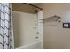 Bathroom features a shower and bathtub combination, towel rack, and shower curtain at 4275 E Amarillo Dr, San Tan Valley, AZ 85140