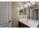 Bathroom featuring a single sink vanity, large mirror, and ample lighting at 4275 E Amarillo Dr, San Tan Valley, AZ 85140