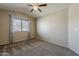 Bedroom featuring neutral paint, carpet flooring, a window with curtains, and a ceiling fan at 4275 E Amarillo Dr, San Tan Valley, AZ 85140