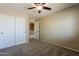 Comfortable bedroom featuring a ceiling fan, closet space and doorway to the upstairs hallway at 4275 E Amarillo Dr, San Tan Valley, AZ 85140