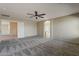 Large bedroom featuring plush neutral carpet with an en suite bathroom and loft access at 4275 E Amarillo Dr, San Tan Valley, AZ 85140