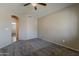 Bedroom featuring neutral paint, carpet flooring, and an arched doorway to another room at 4275 E Amarillo Dr, San Tan Valley, AZ 85140